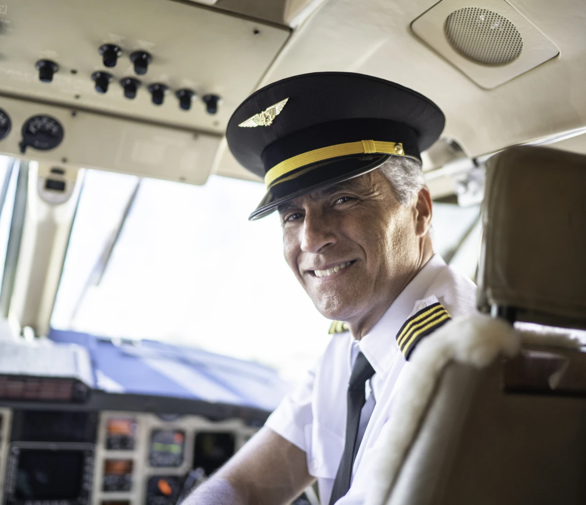 Smiling pilot in airplane cockpit